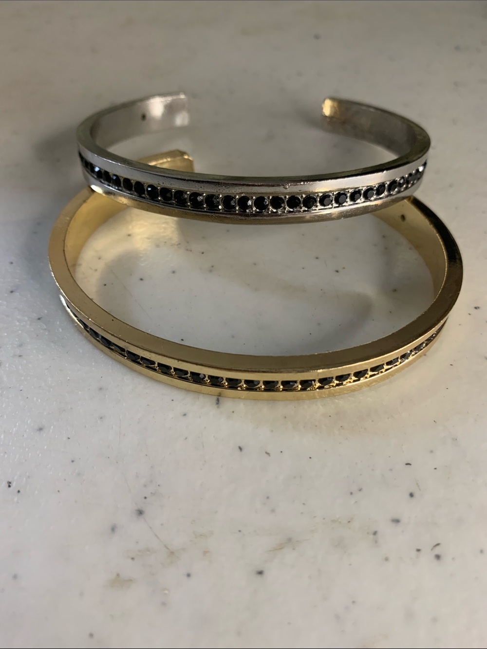 Gold and Silver Cuff Bracelets with Black Stone Accents